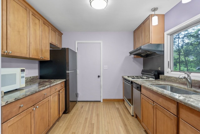132 Pratt Blvd, Roselle, IL 60172 - kitchen with white appliances, under cabinet range hood, a sink, light wood-style floors, and brown cabinets