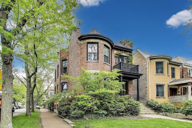 5357 N Wayne Ave, Chicago, IL 60640 - view of front of property featuring a balcony and brick siding