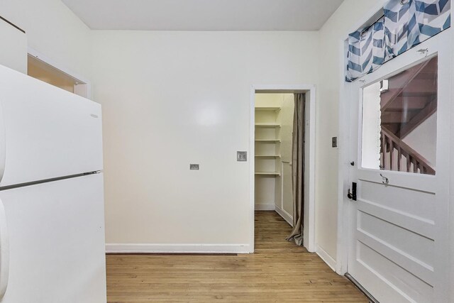 5357 N Wayne Ave, Chicago, IL 60640 - kitchen with freestanding refrigerator, light wood-style flooring, and baseboards