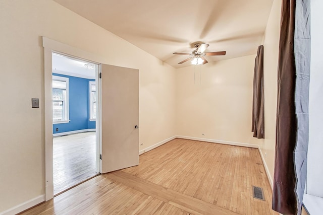 5357 N Wayne Ave, Chicago, IL 60640 - spare room with light wood-style floors, ceiling fan, and baseboards