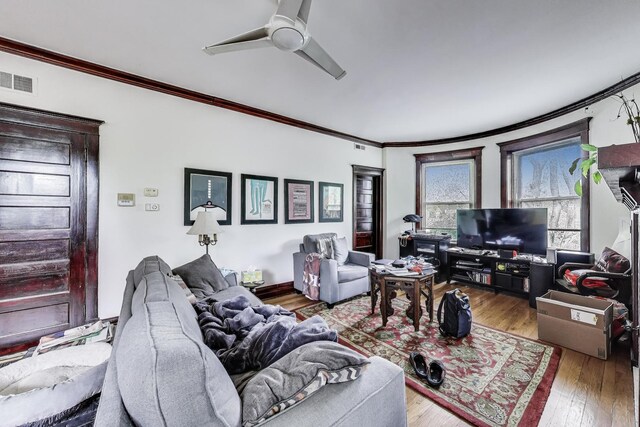 5357 N Wayne Ave, Chicago, IL 60640 - living area with ornamental molding, ceiling fan, and wood finished floors