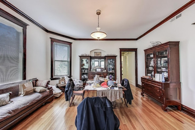 5357 N Wayne Ave, Chicago, IL 60640 - office area with light wood-style flooring, crown molding, and baseboards