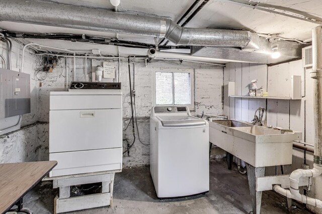5357 N Wayne Ave, Chicago, IL 60640 - washroom with washing machine and dryer and electric panel