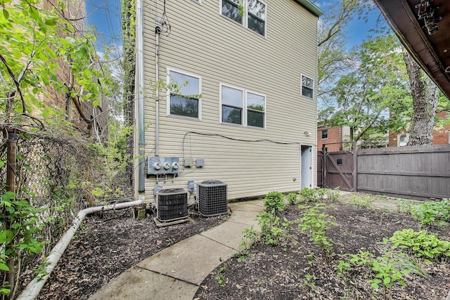 5357 N Wayne Ave, Chicago, IL 60640 - rear view of property featuring a gate and central air condition unit