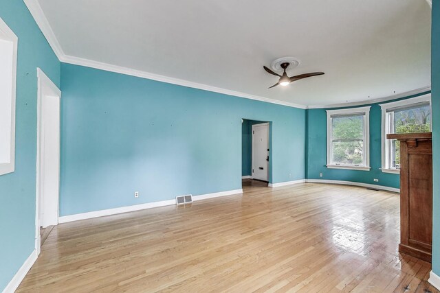 5357 N Wayne Ave, Chicago, IL 60640 - spare room with ornamental molding, light wood-type flooring, baseboards, and ceiling fan