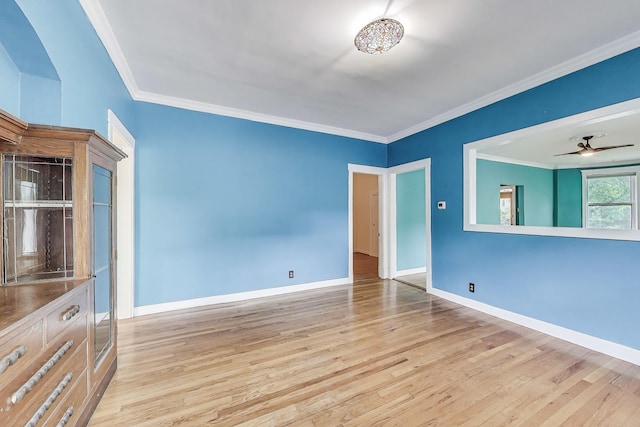 5357 N Wayne Ave, Chicago, IL 60640 - unfurnished room featuring wood finished floors, baseboards, ornamental molding, and a ceiling fan