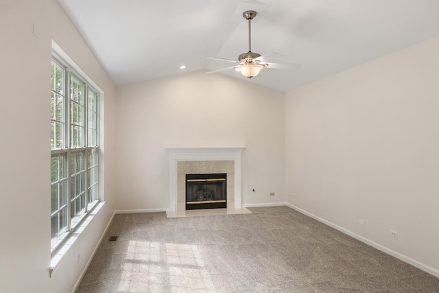 240 Regency Blvd, Sugar Grove, IL 60554 - unfurnished living room featuring a ceiling fan, a tile fireplace, light carpet, lofted ceiling, and baseboards