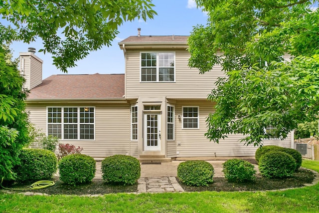 240 Regency Blvd, Sugar Grove, IL 60554 - rear view of property featuring entry steps, a chimney, and a yard