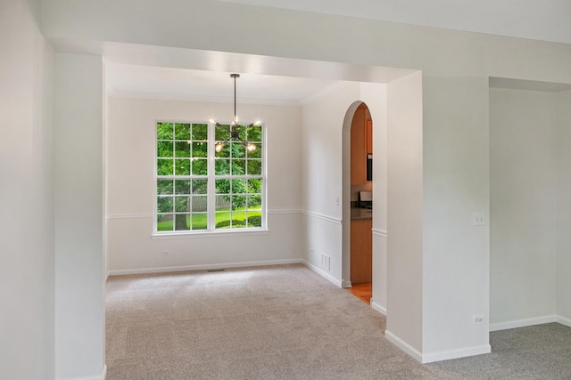 240 Regency Blvd, Sugar Grove, IL 60554 - unfurnished room with arched walkways, light colored carpet, baseboards, and ornamental molding