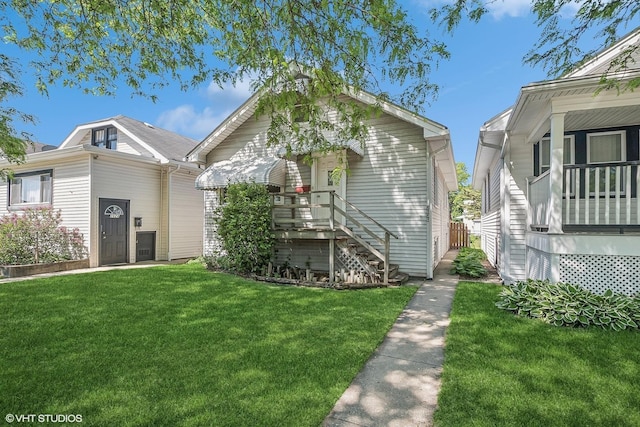 2630 N Austin Ave, Chicago, IL 60639 - shotgun-style home with a front lawn