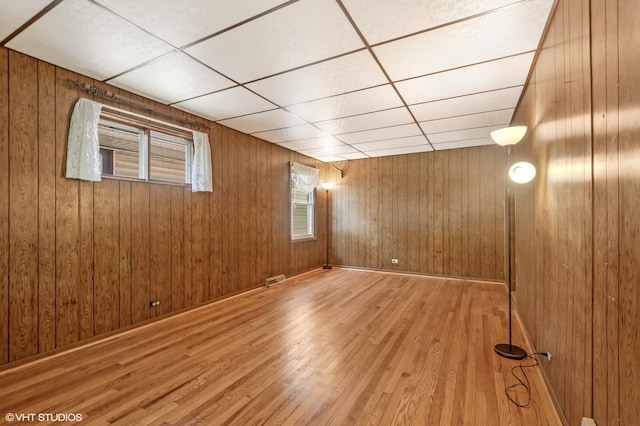 2630 N Austin Ave, Chicago, IL 60639 - empty room with wood finished floors and wood walls