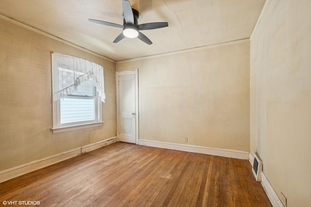 2630 N Austin Ave, Chicago, IL 60639 - unfurnished room with wood finished floors, ceiling fan, baseboards, and crown molding
