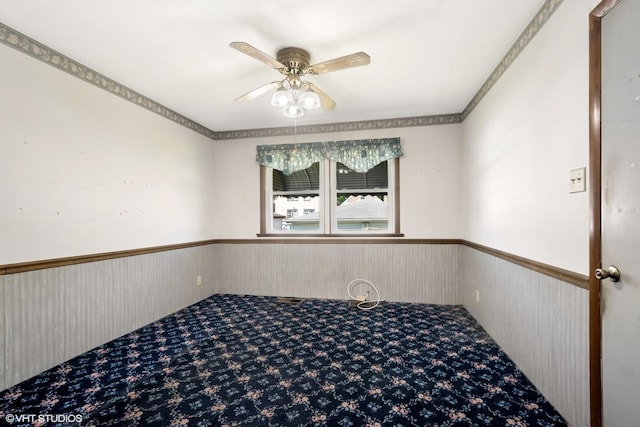 2630 N Austin Ave, Chicago, IL 60639 - carpeted empty room featuring wainscoting and ceiling fan