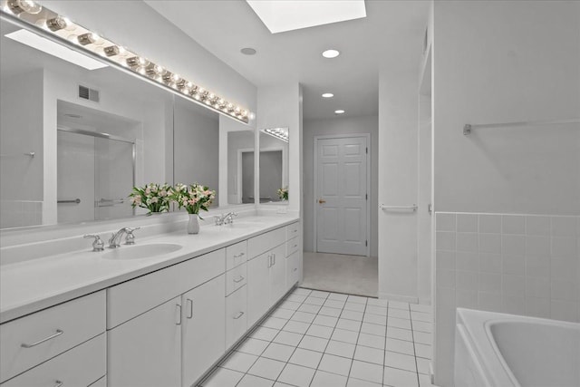 380 Green Bay Rd Unit 4D, Winnetka, IL 60093 - full bathroom with a skylight, double vanity, a bath, tile patterned flooring, and a shower with door