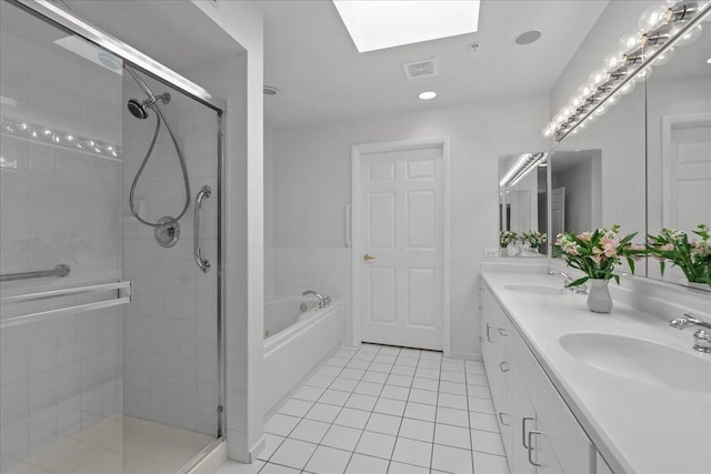 380 Green Bay Rd Unit 4D, Winnetka, IL 60093 - full bathroom with a skylight, tile patterned flooring, double vanity, a stall shower, and a bath