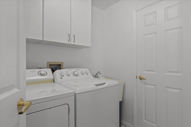 380 Green Bay Rd Unit 4D, Winnetka, IL 60093 - laundry room featuring washer and dryer and cabinet space