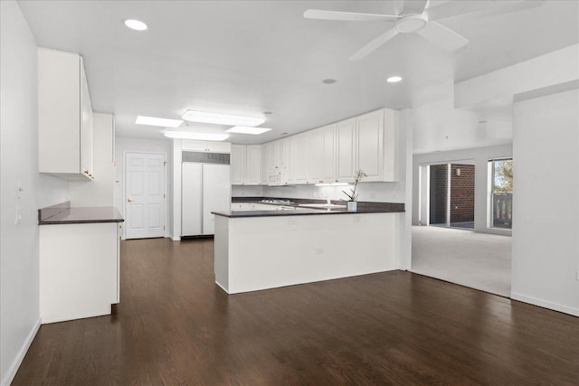 380 Green Bay Rd Unit 4D, Winnetka, IL 60093 - kitchen with paneled refrigerator, dark countertops, a peninsula, recessed lighting, and ceiling fan