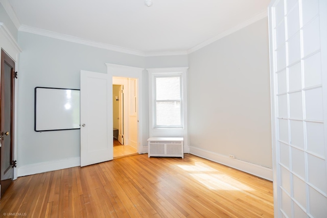 5707 S Blackstone Ave Unit 2, Chicago, IL 60637 - unfurnished bedroom featuring radiator heating unit, light wood finished floors, ornamental molding, and baseboards
