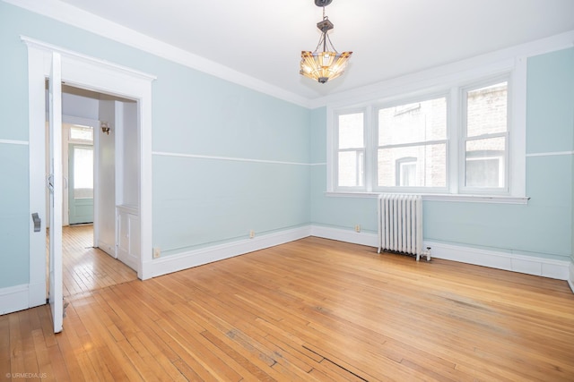 5707 S Blackstone Ave Unit 2, Chicago, IL 60637 - unfurnished room with radiator heating unit, a chandelier, light wood-style floors, and baseboards