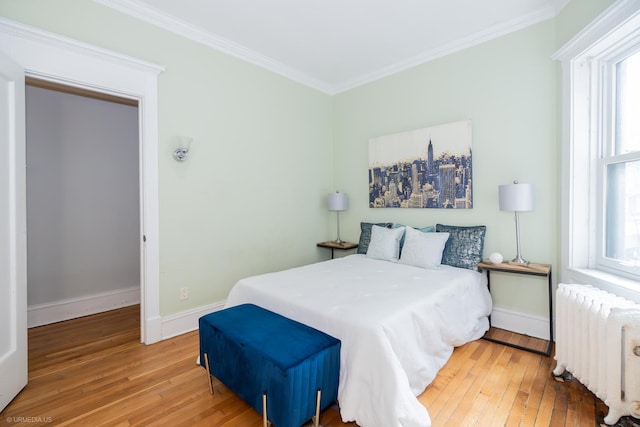 5707 S Blackstone Ave Unit 2, Chicago, IL 60637 - bedroom featuring radiator, wood-type flooring, crown molding, and baseboards