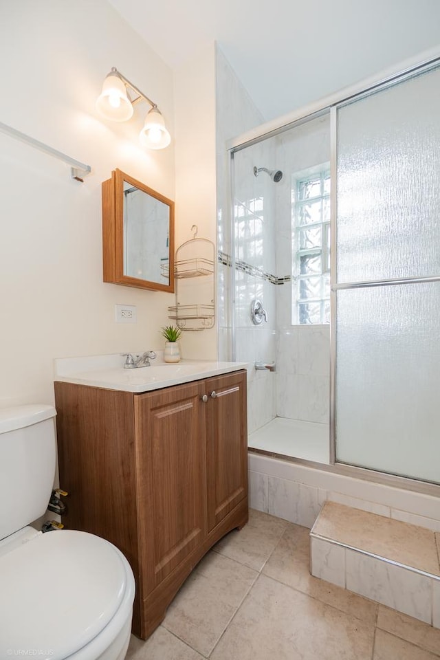 5707 S Blackstone Ave Unit 2, Chicago, IL 60637 - bathroom with toilet, a tile shower, vanity, and tile patterned flooring