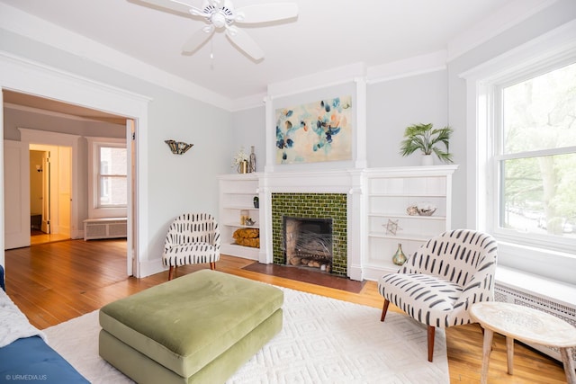 5707 S Blackstone Ave Unit 2, Chicago, IL 60637 - living room featuring a ceiling fan, radiator, plenty of natural light, and wood finished floors