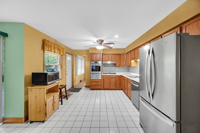 301 N Illinois Ave, Glenwood, IL 60425 - kitchen featuring stainless steel appliances, a warming drawer, light countertops, backsplash, and a sink