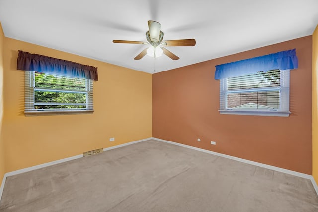 301 N Illinois Ave, Glenwood, IL 60425 - empty room with carpet flooring, a ceiling fan, and baseboards