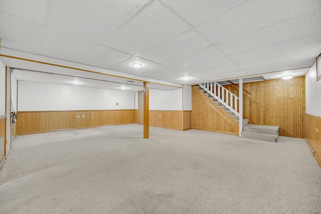 301 N Illinois Ave, Glenwood, IL 60425 - finished basement featuring stairway, wood walls, carpet, a drop ceiling, and a wainscoted wall