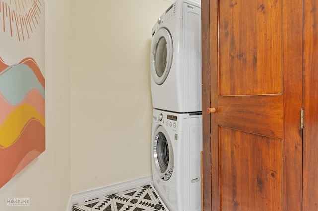 13 N Cannonball Trl, Bristol, IL 60512 - washroom with estacked washer and dryer, baseboards, and tile patterned floors