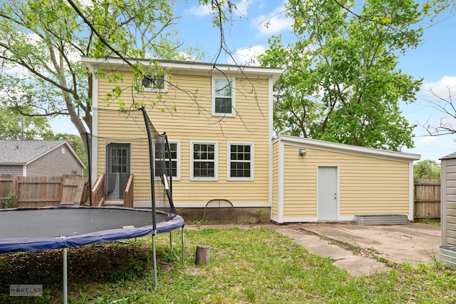 13 N Cannonball Trl, Bristol, IL 60512 - back of property with a trampoline and a patio