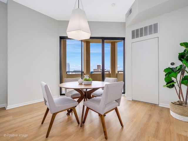 1464 S Michigan Ave Unit 2201, Chicago, IL 60605 - dining room with light wood finished floors and baseboards