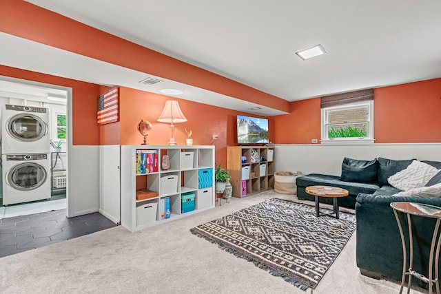 925 S Chestnut Ave, Arlington Heights, IL 60005 - living area with stacked washing machine and dryer, healthy amount of natural light, and carpet