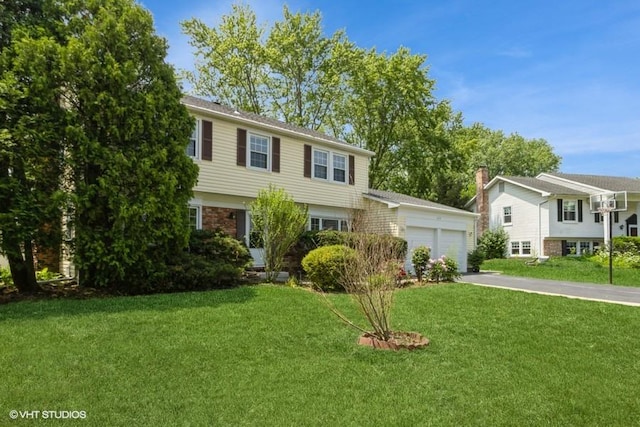 679 Aspen Dr, Buffalo Grove, IL 60089 - view of front of house with a front lawn and a garage