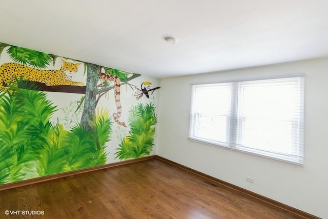 679 Aspen Dr, Buffalo Grove, IL 60089 - unfurnished room featuring plenty of natural light and wood finished floors