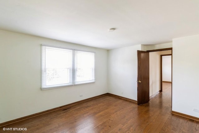 679 Aspen Dr, Buffalo Grove, IL 60089 - unfurnished room with wood finished floors and a smoke detector