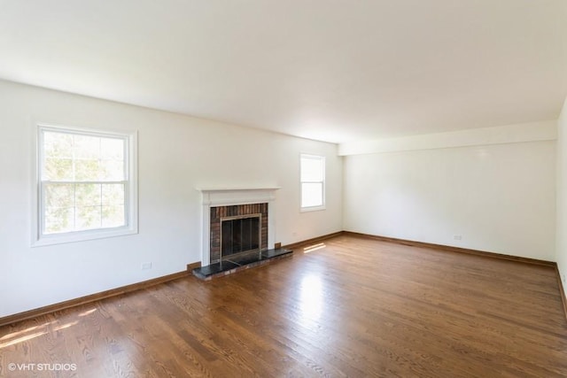 679 Aspen Dr, Buffalo Grove, IL 60089 - unfurnished living room featuring a fireplace and wood finished floors