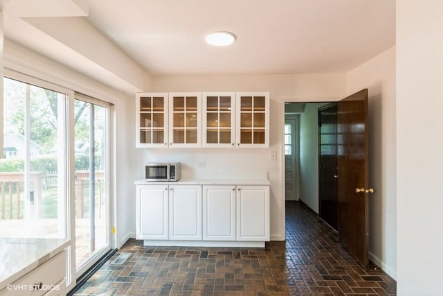 679 Aspen Dr, Buffalo Grove, IL 60089 - kitchen with white cabinets, glass insert cabinets, and stainless steel microwave