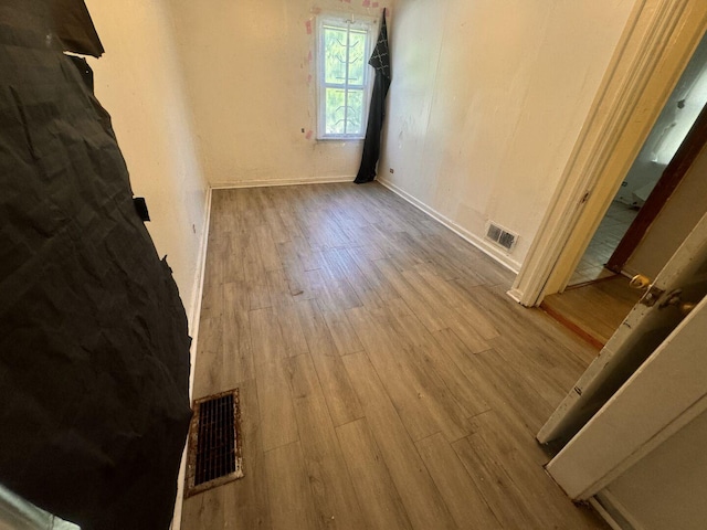 14508 Des Plaines St, Harvey, IL 60426 - spare room with wood finished floors and baseboards