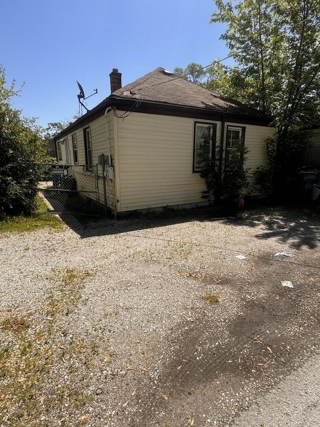 14508 Des Plaines St, Harvey, IL 60426 - view of property exterior with a chimney