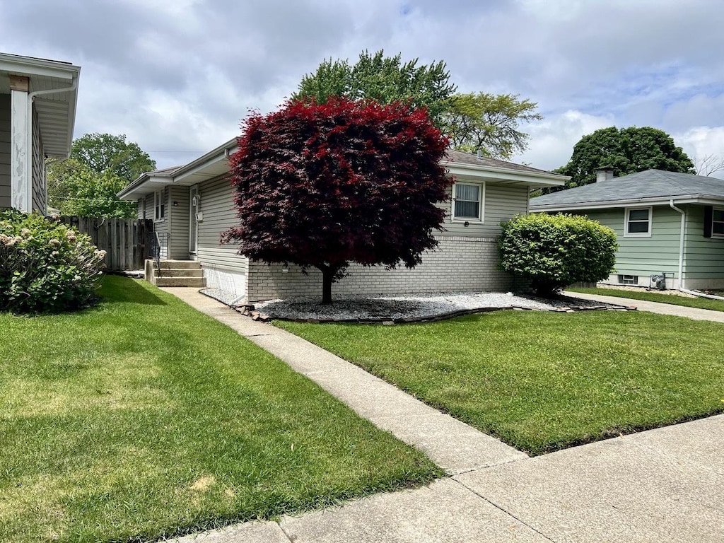 17836 Ridgewood Ave, Lansing, IL 60438 - view of property exterior featuring a yard and brick siding