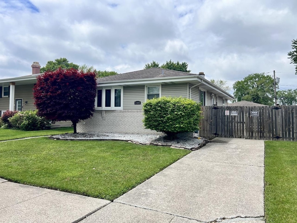 17836 Ridgewood Ave, Lansing, IL 60438 - view of front of home with brick siding and a chimney