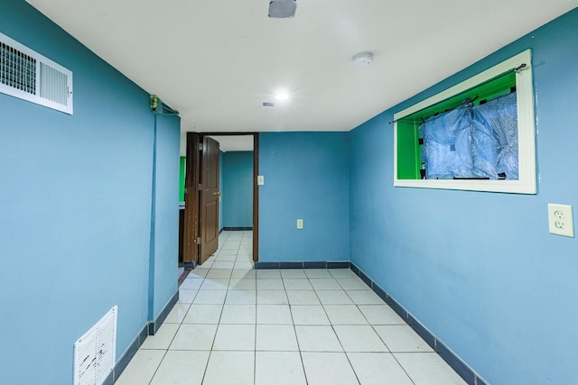 2807 S Spaulding Ave, Chicago, IL 60623 - spare room featuring baseboards, a smoke detector, and light tile patterned floors
