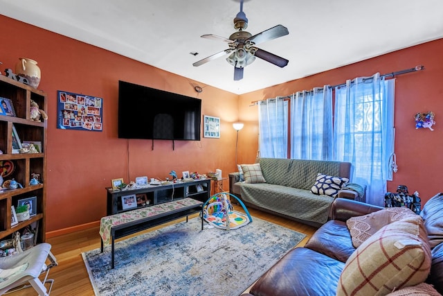 2807 S Spaulding Ave, Chicago, IL 60623 - living room with wood finished floors, ceiling fan, and baseboards