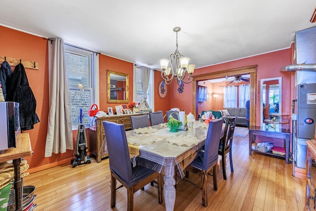 2807 S Spaulding Ave, Chicago, IL 60623 - dining space with a chandelier and light wood-type flooring
