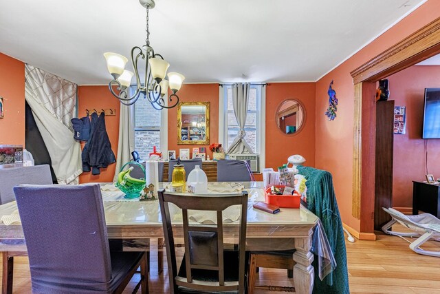 2807 S Spaulding Ave, Chicago, IL 60623 - dining space featuring a chandelier and wood finished floors