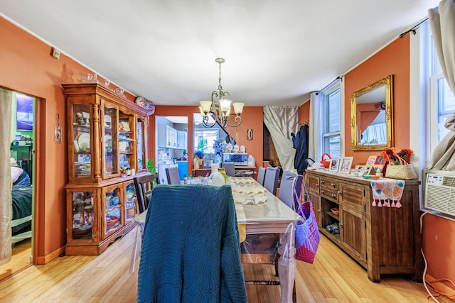 2807 S Spaulding Ave, Chicago, IL 60623 - dining room with a chandelier and light wood-style flooring