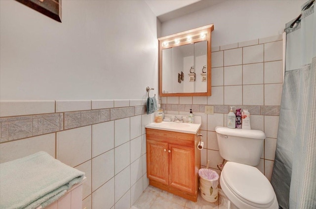 2511 Sangamon Dr, Champaign, IL 61821 - full bathroom with tile walls, vanity, curtained shower, and tile patterned floors