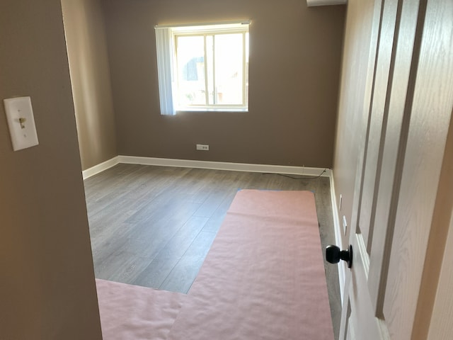 3012 171st St Unit D2, Hazel Crest, IL 60429 - unfurnished room featuring wood finished floors and baseboards