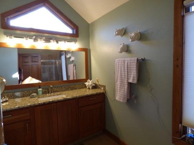 2 Tamarack Row, Galena, IL 61036 - bathroom featuring lofted ceiling, vanity, a shower stall, and baseboards